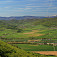 Pohľad na západný okraj Rožňavskej kotliny, na obzore Stolické vrchy