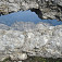 Nádherné skalné okno na Schermberg Klettersteig, v priezore skalný hrebeň