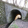 Tunel pre potok a chodník na nedokončenej železničnej trati Revúca - Tisovec